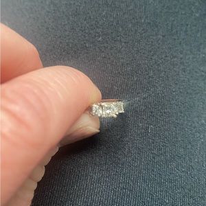 1/2 carrot diamond -3 diamond- white gold -size 7-can’t find papers on it.